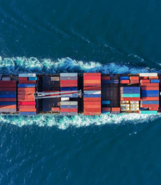 Aerial view Top speed with beautiful wave of container ship full load container with crane loading container for logistics import  export or transportation concept background.